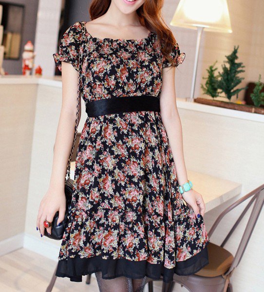 Blush a knee-length dress with a pink and black belt and floral pattern