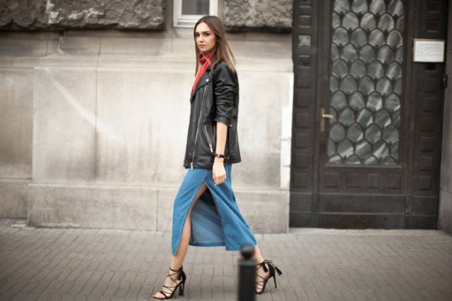 black oversized leather jacket with blue midi jeans skirt with high slit