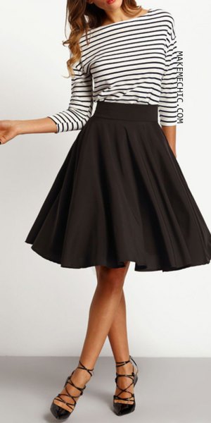 black and white striped long-sleeved t-shirt with a knee-length skater skirt