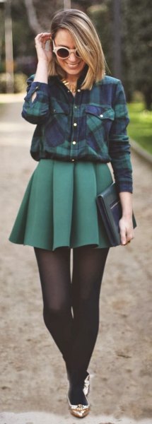 Navy plaid shirt with a gray pleated skirt