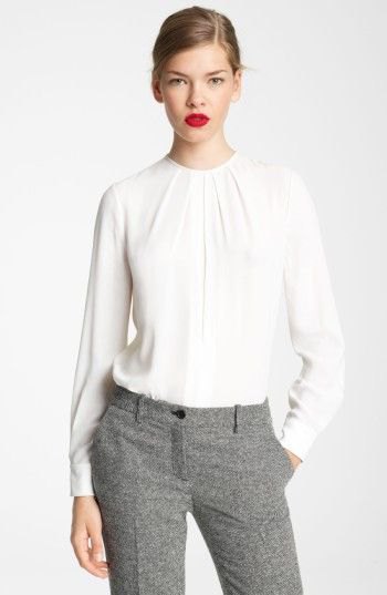 white long-sleeved blouse with a round neckline and relaxed fit and tweed pants