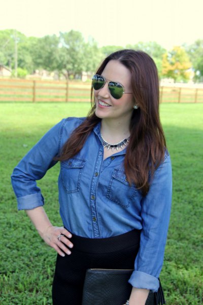 blue chambray shirt with buttons and black skyscraper jeans