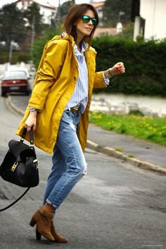 yellow oversized rain jacket with boyfriend shirt and torn jeans