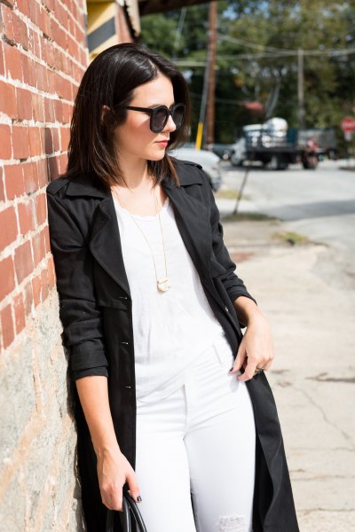 black longline coat with white tank top and matching skinny jeans