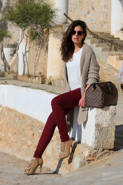gray, ribbed longline cardigan with maroon jeans and boots with heels