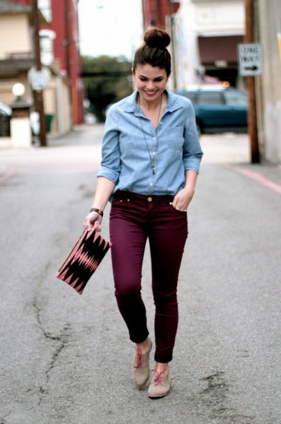 Light blue shirt with buttons and maroon slim fit jeans