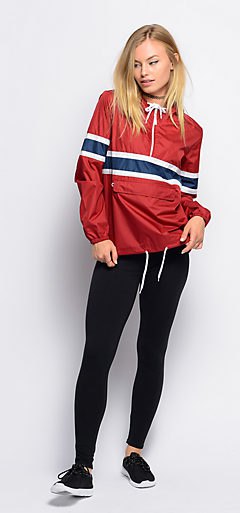 red sweater windbreaker with black leggings and sneakers
