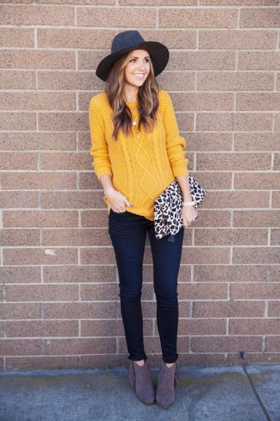 Cable mustard sweater with black felt hat and leopard print purse