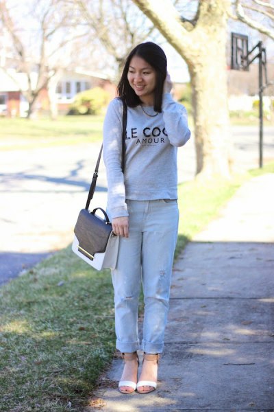 sweater with light blue cuffed boyfriend jeans and blush pink open toe short boots