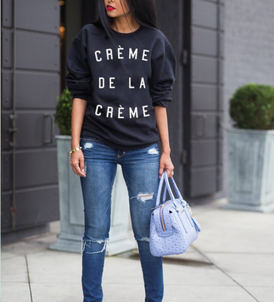 black chunky sweater with blue ripped slim fit jeans