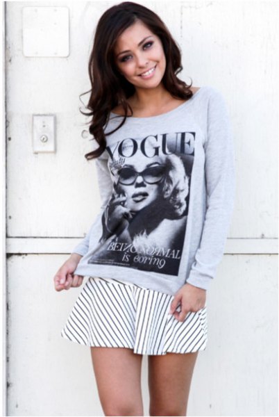 gray graphic sweater with white and black striped skater mini skirt