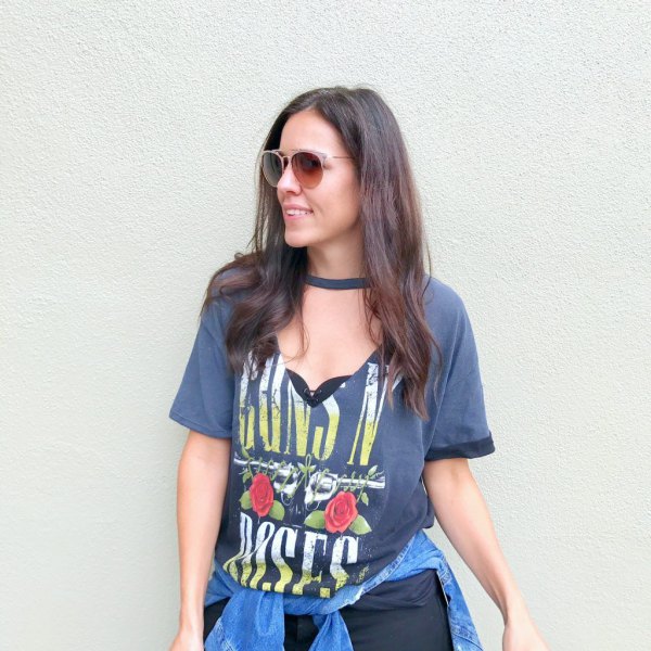 gray graphic tee with v-neck with denim jacket tied around the waist