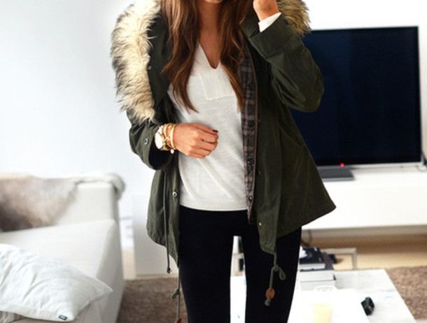 black fur jacket with white v-neck tee and slim jeans