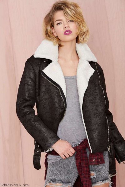 white faux fur collar black flying jacket with gray ripped jeans