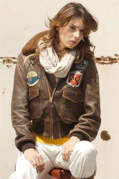 embroidered jacket in brown leather with white linen trousers