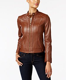 brown leather fly jacket with black skinny jeans