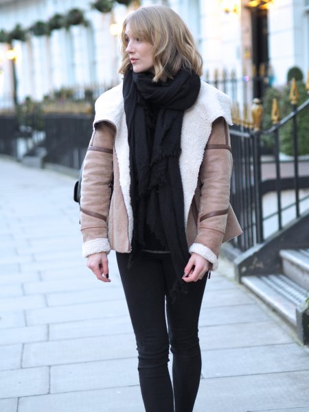 pink pink wing jacket with black sweater and knitted scarf
