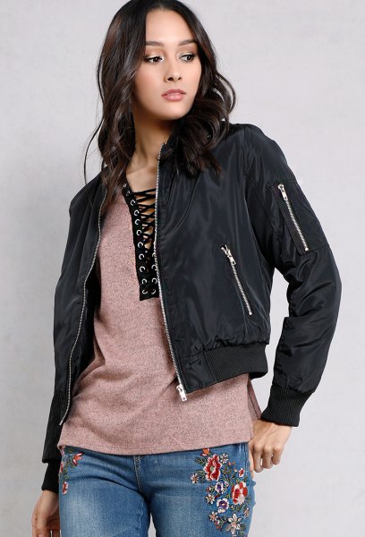 black fitted jacket with gray lace tee and embroidered jeans