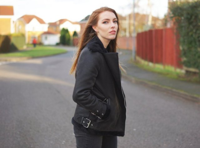 black flying jacket with matching slim fit jeans and boots