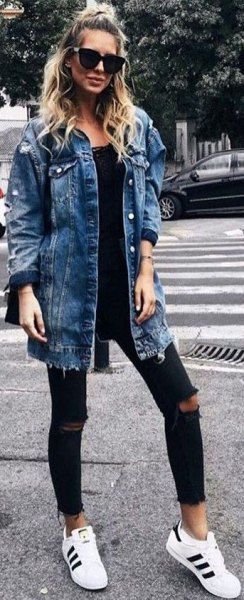 blue boyfriend clothing jacket with black lace neck and ripped jeans