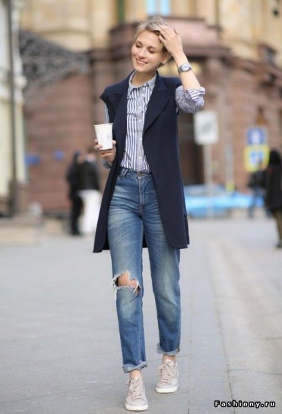 black vest jacket with blue and white vertical striped shirt and boyfriend jeans