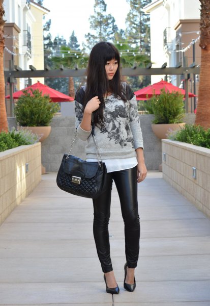 gray printed sweater with white chiffon blouse and black padded leather bag