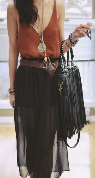 green vest top with bucket neck with black chiffon midi skirt and leather bag