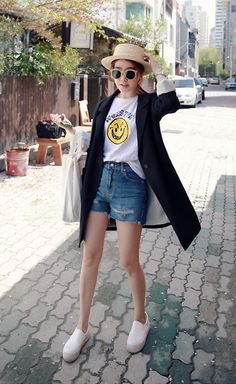 black long-line cardigan with white printed tee and blue denim shorts