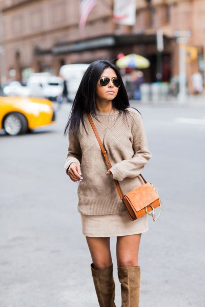 blush pink chunky knitted sweater with mini ivory skirt and brown suede bag