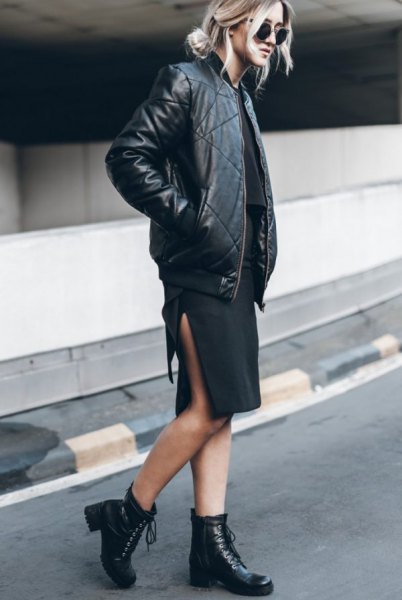 black leather fly jacket with dress with high slit at the knee