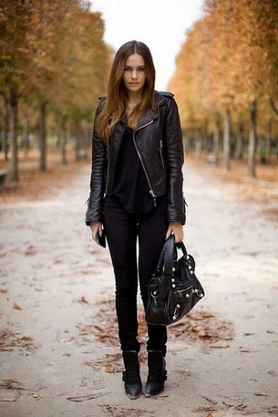 black leather riding jacket with scoop neck and skinny jeans