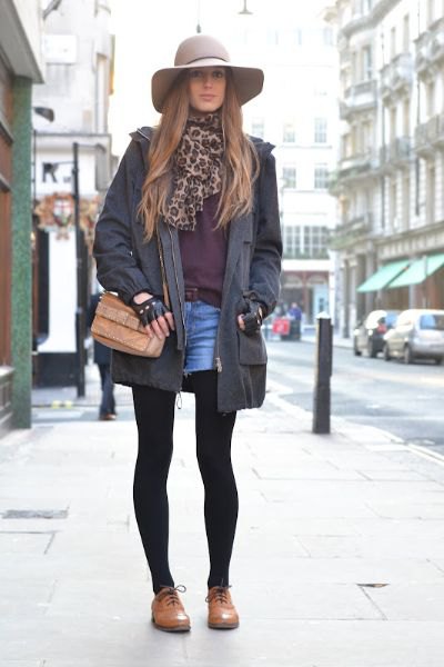 black long blazer with blue denim shorts and brown leather shoes
