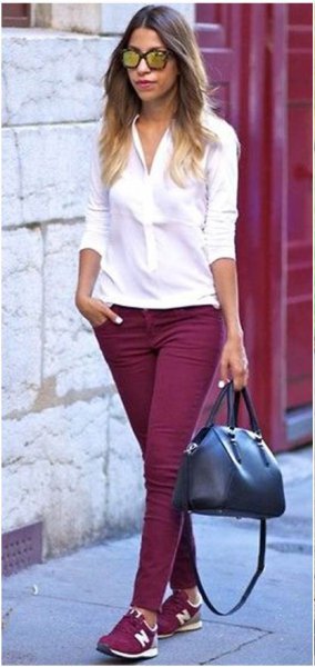 white, slim cut blouse with buttons, burgundy skinny jeans and matching shoes