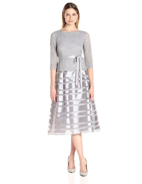 gray and silver medium length dress with fit and flap