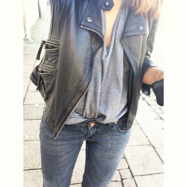 black oversized leather jacket with gray draped top and slim jeans