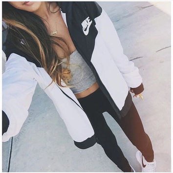 Black and white color block Nike windbreaker with gray crop top