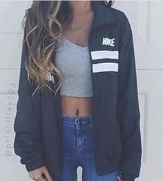 gray crop top with oversized windbreaker and blue skinny jeans