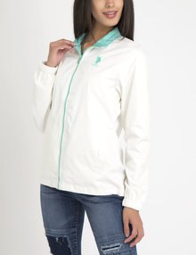 white polo windbreaker with blue ribbed skinny jeans