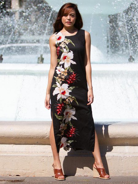 black maxi dress with side slit and floral print and brown sandals