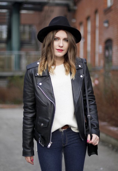 black felt hat with leather jacket and white, thick sweater