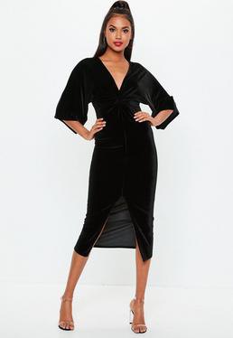 black, wide dress with three-quarter sleeves and V-neck