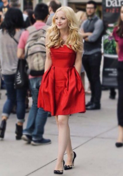 red silk mid-fit and flare dress with black heels