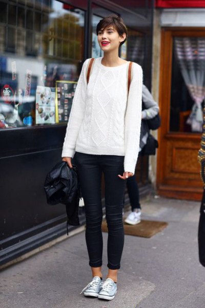 white cable knit sweater with blue skinny jeans with cuffs