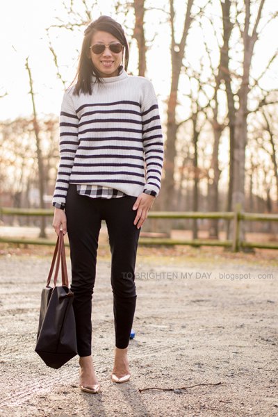 white and black sweater over plaid shirt