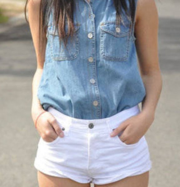 blue sleeveless chambray shirt with buttons and white shorts