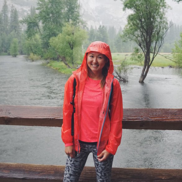 bright red hiking jacket with black and gray printed leggings