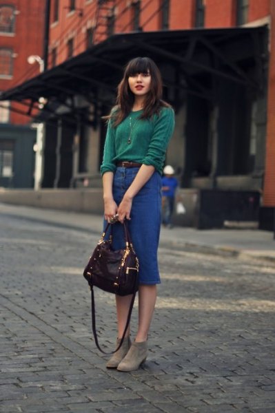 Sweater with blue denim midi skirt and gray ankle boots