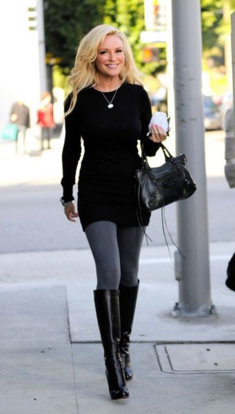 black tunic sweater with gray leggings and knee-high leather boots