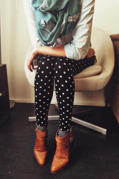 white hoodie with dotted leggings and brown leather boots