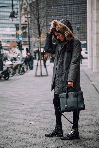 gray oversized bomber jacket with hood, black leggings and boots